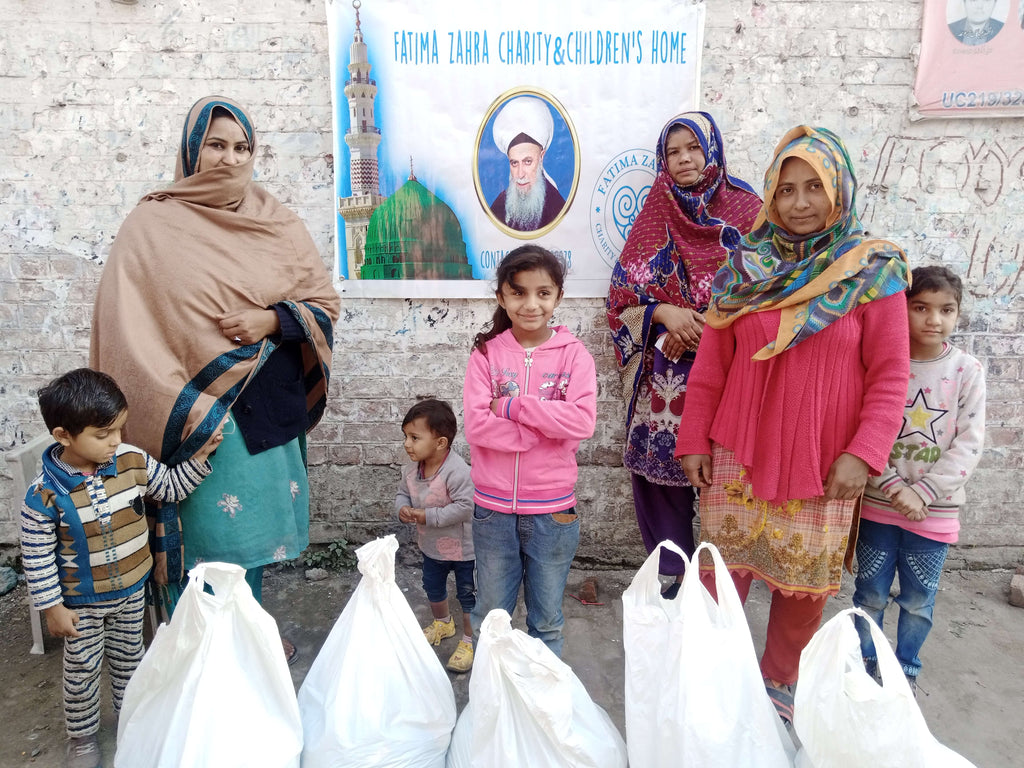 Lahore, Pakistan - Participating in Mobile Food Rescue Program by Distributing Monthly Ration to Local Community's Less Privileged Families