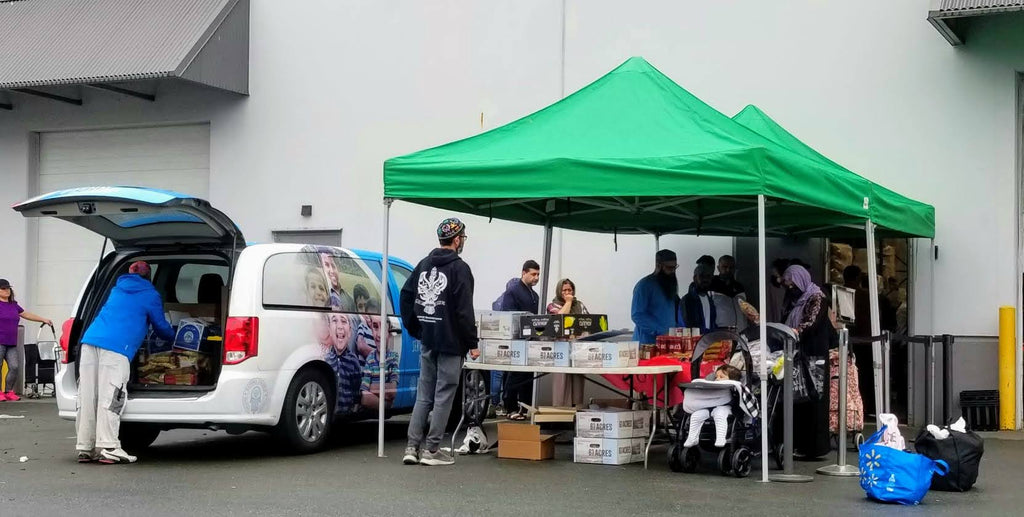 Vancouver - Honoring Holy Eid al-Adha & Shahadat/Witnessing of Sayyidina Uthman al Ghani Jami’ull Quran al Majeed (compiler of Holy Quran) ع by Distributing 200+ Holy Qurbans to Refugee Families at Muslim Food Bank