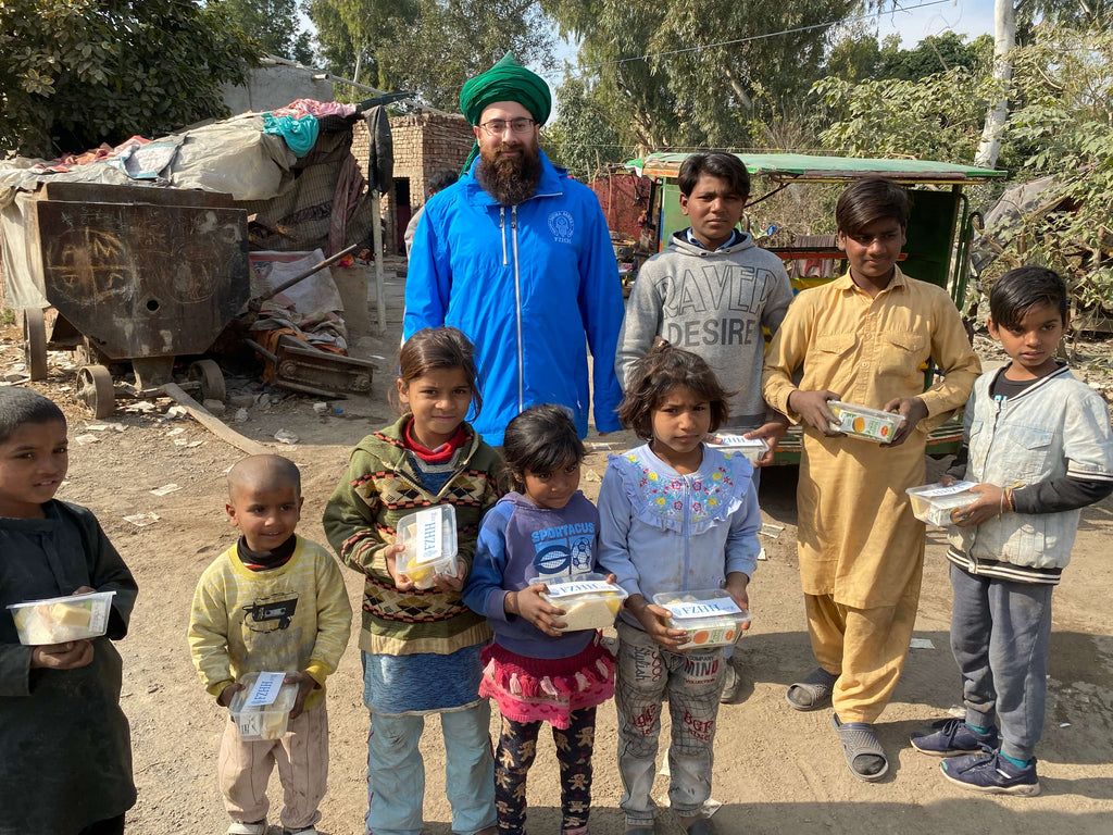 Lahore, Pakistan - Participating in Mobile Food Rescue Program by Distributing Hot Home Made Meals with Juices & Sweets to Local Community's Less Privileged People