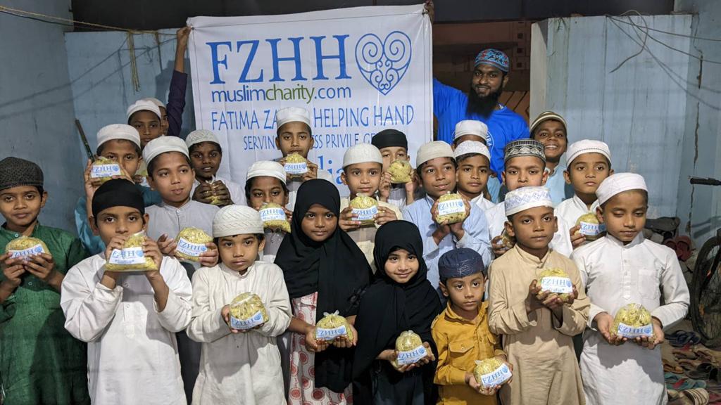 Hyderabad, India - Participating in Mobile Food Rescue Program by Distributing Hot Meals to Children at 2 Local Madrasas/Schools & Local Community's Less Privileged Women & Children