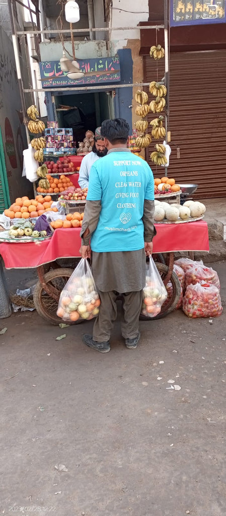 Karachi, Pakistan - Participating in Mobile Food Rescue Program by Distributing Fresh Fruit Packages to Local Community's Homeless & Less Privileged People