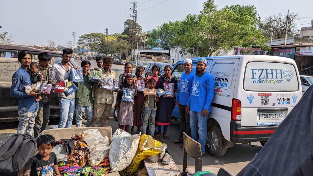 Hyderabad, India - Participating in Mobile Food Rescue Program by Purchasing, Packaging & Distributing Brand New Clothes & Slippers to Local Community's Homeless Families (Mothers, Fathers, Daughters & Children)