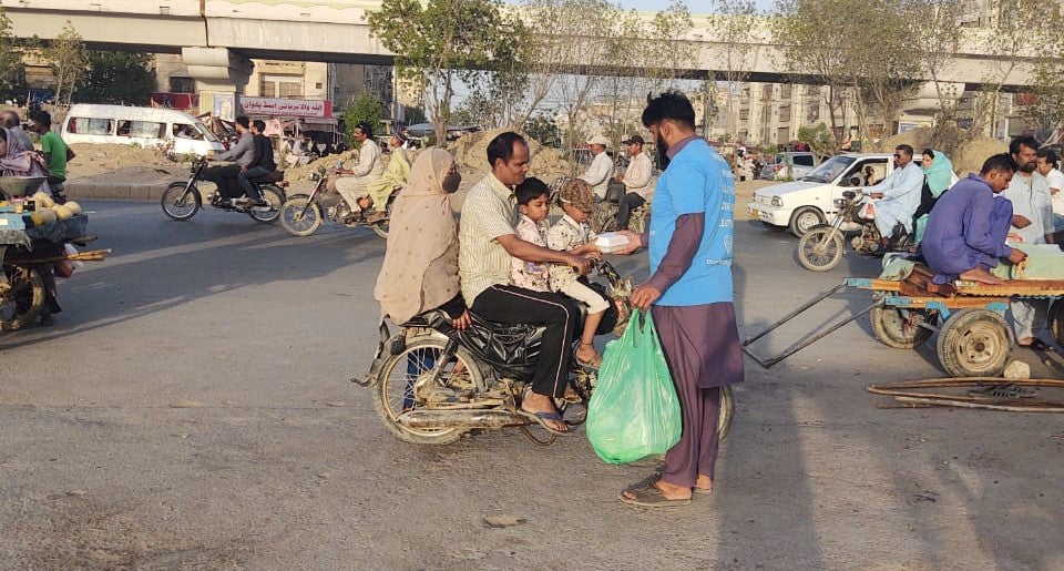 Karachi, Pakistan - Participating in Mobile Food Rescue Program by Distributing Hot Meals to Local Community's Homeless & Less Privileged People