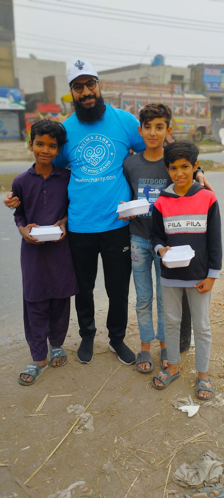 Lahore, Pakistan - Participating in Mobile Food Rescue Program by Distributing Hot Meals to Local Community's Homeless & Less Privileged Families