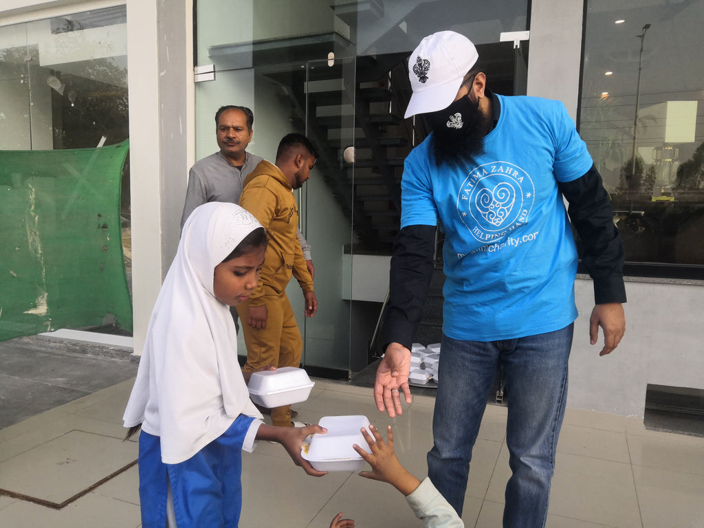 Lahore, Pakistan - Participating in Mobile Food Rescue Program by Serving Hot Meals to Local Community's Homeless & Less Privileged Families