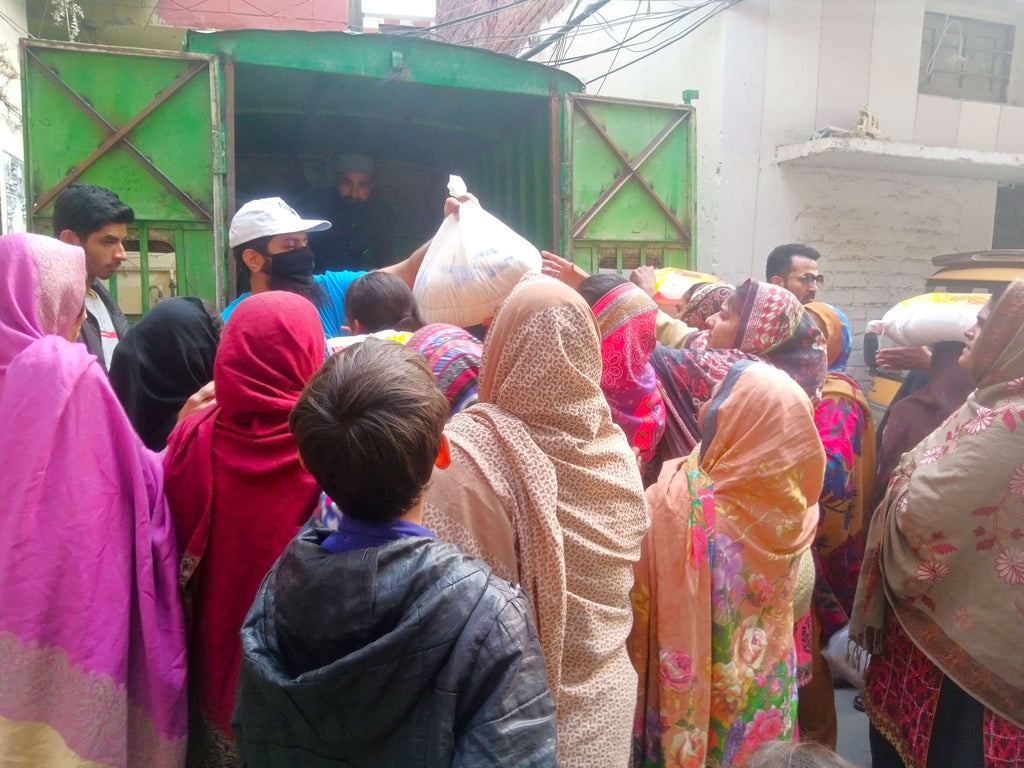 Lahore, Pakistan - Participating in Month of Ramadan Appeal Program & Mobile Food Rescue Program by Distributing Monthly Ration to 50+ Less Privileged Families