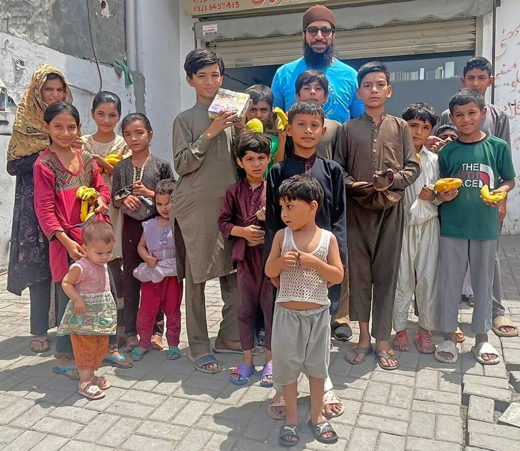 Lahore, Pakistan - Participating in Mobile Food Rescue Program by Serving Variety of Fresh Fruits to Less Privileged Children