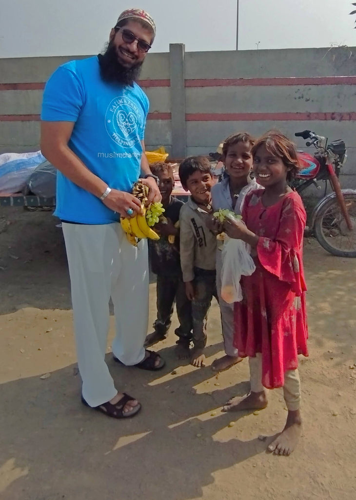 Lahore, Pakistan - Participating in Mobile Food Rescue Program by Distributing Fresh Fruits to Homeless & Less Privileged People