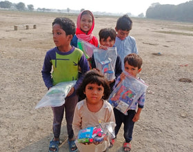 Lahore, Pakistan - Participating in Mobile Food Rescue Program by Distributing Goodie Bags Filled with Candies & Gifts to Local Community's Less Privileged Children