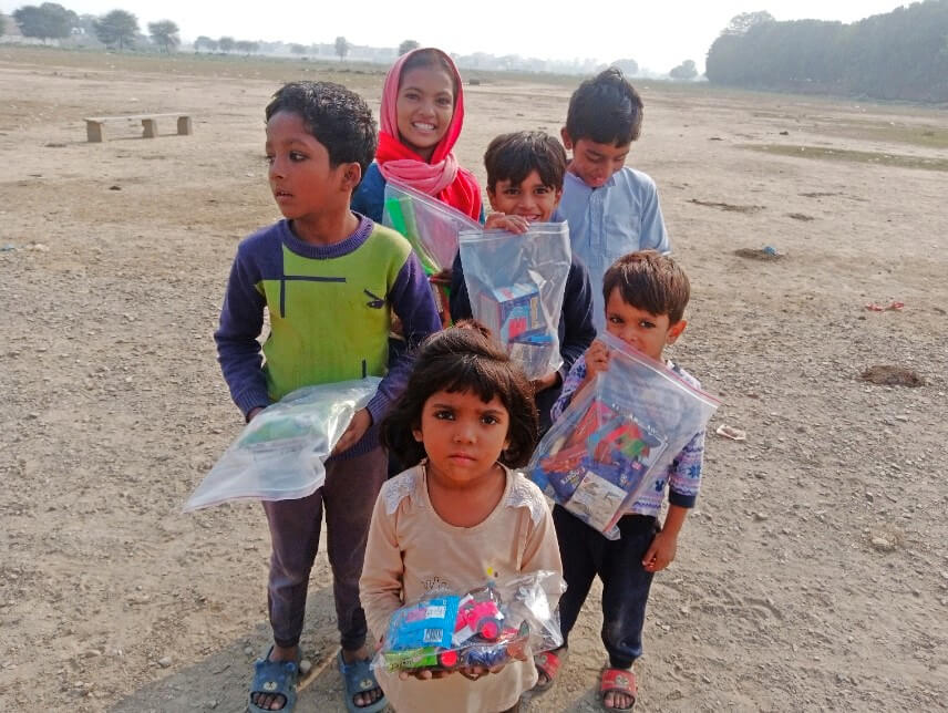 Lahore, Pakistan - Participating in Mobile Food Rescue Program by Distributing Goodie Bags Filled with Candies & Gifts to Local Community's Less Privileged Children