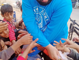 Lahore, Pakistan - Participating in Mobile Food Rescue Program by Preparing, Packaging & Distributing Hot Meals & Fruit Juices to 100+ Less Privileged Children & Adults