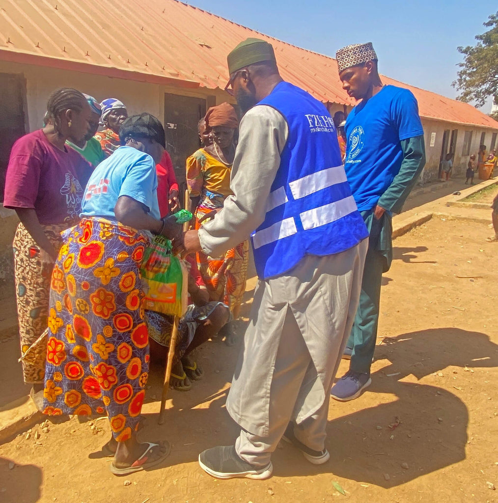 Abuja, Nigeria - Participating in Mobile Food Rescue Program by Distributing 13+ Rice Bags, 10+ Footwears & Lots of Candies to Less Privileged Children & Adults