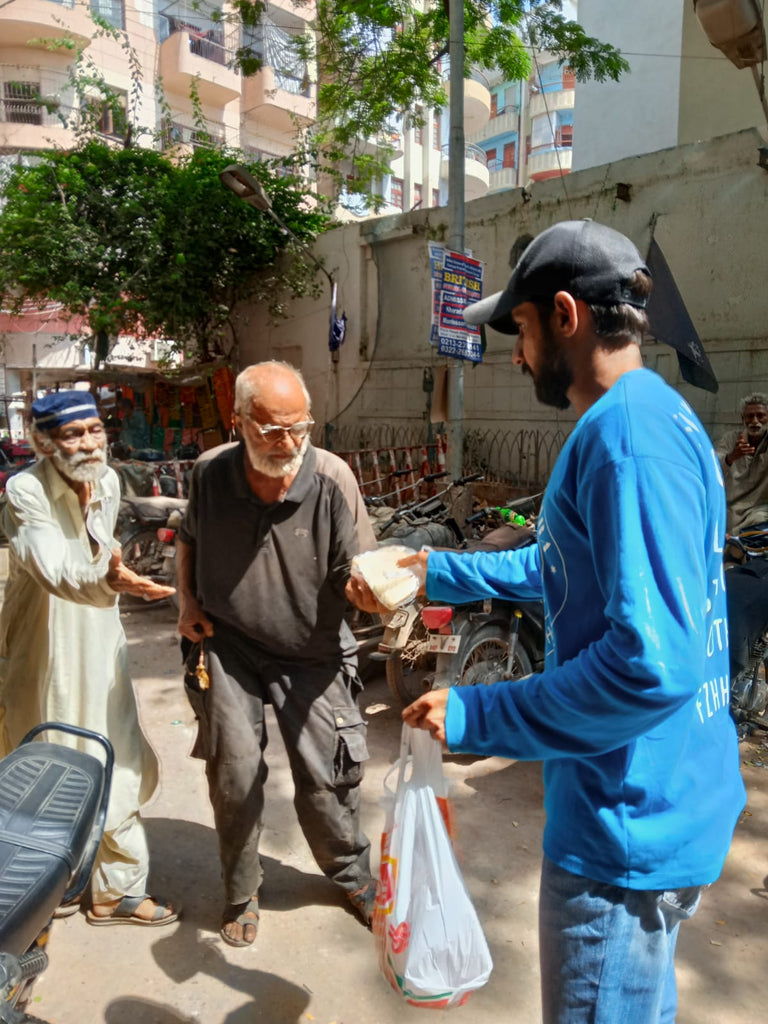 Karachi, Pakistan - Honoring Wiladat/Holy Birthday of Sayyidina Imam Mūsā al-Kāẓim ع by Distributing Hot Meals to Local Community's Homeless & Less Privileged People