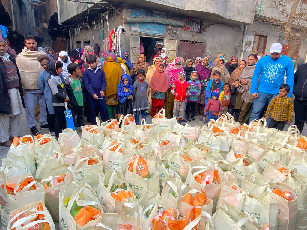 Lahore, Pakistan - Participating in Mobile Food Rescue Program by Distributing Monthly Ration to Local Community's 68+ Less Privileged Families