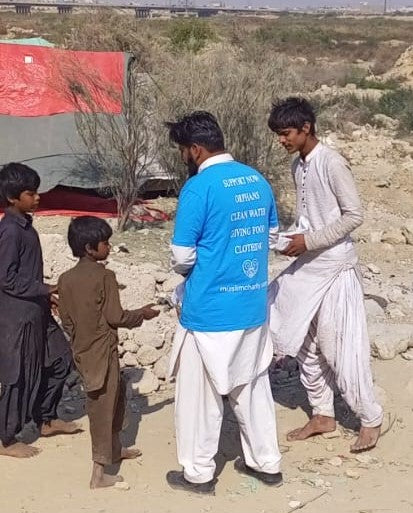 Karachi, Pakistan - Participating in Mobile Food Rescue Program by Distributing Hot Meals (Biryani) & Water Bottles to Local Community's Homeless & Less Privileged People