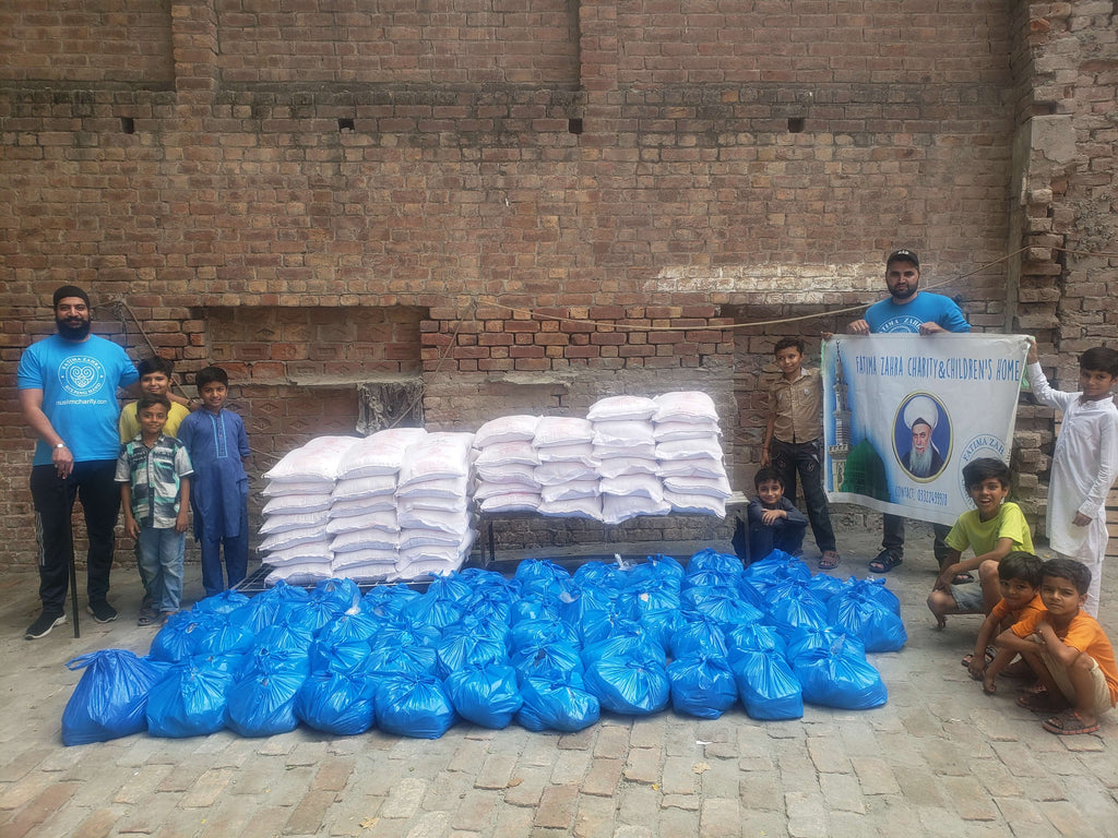 Lahore, Pakistan - Participating in Mobile Food Rescue Program by Distributing Monthly Ration to Local Community's 64+ Less Privileged Families