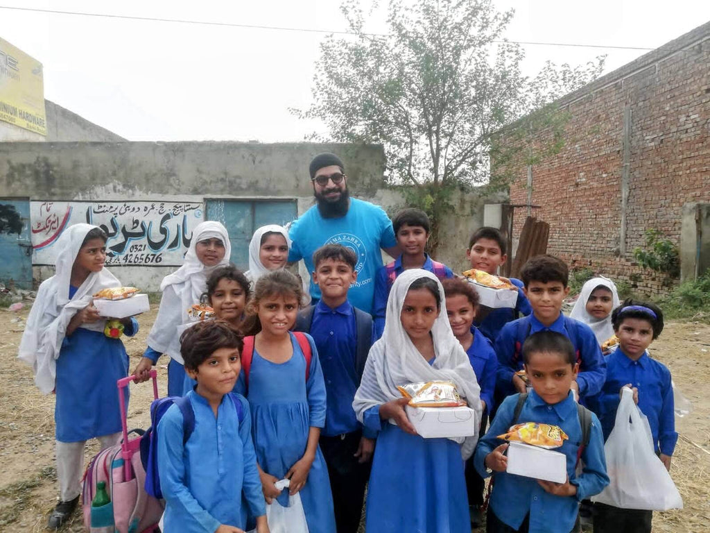 Lahore, Pakistan - Participating in Mobile Food Rescue Program by Distributing Hot Meal Kits with Juice & Dessert to Less Privileged Children & People in Need