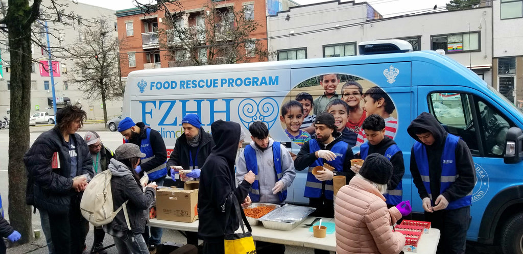 Vancouver, Canada - Participating in Mobile Food Rescue Program by Serving Hot Meals with Drinks & Desserts & Distributing Warm Apparel to Local Community's Homeless & Less Privileged People