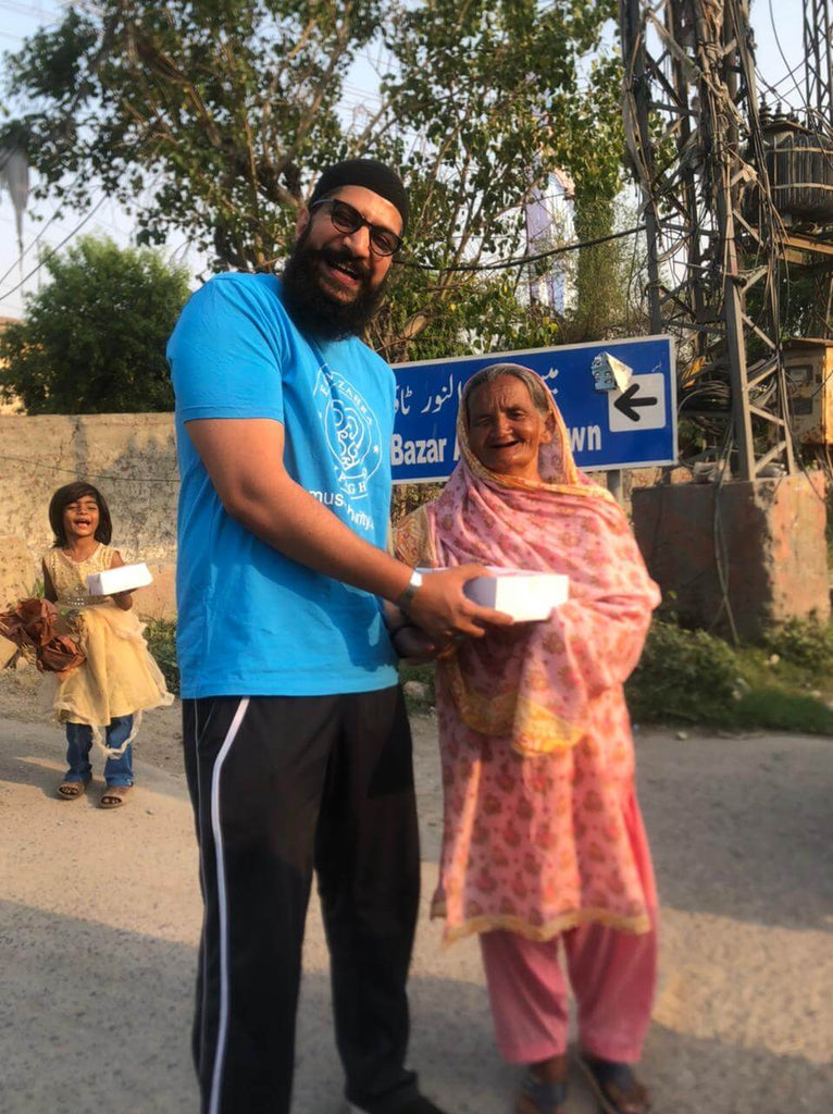 Lahore, Pakistan - Participating in Mobile Food Rescue Program by Distributing Hot Meal Kits with Cold Drinks & Desserts to Local Community's Homeless & Less Privileged People